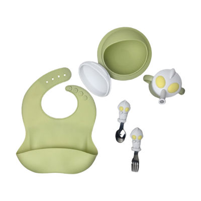 Le personnage de dessin animé forment le bébé que la cuillère de cuvette de bavoir de silicone a placé Bpa libre
