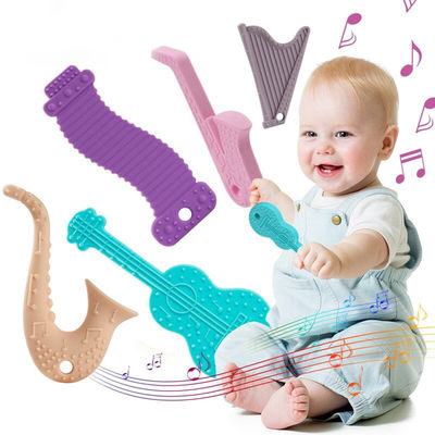 La boîte à outils masticable de tétine de dentition de silicone a placé les jouets mous de Soother